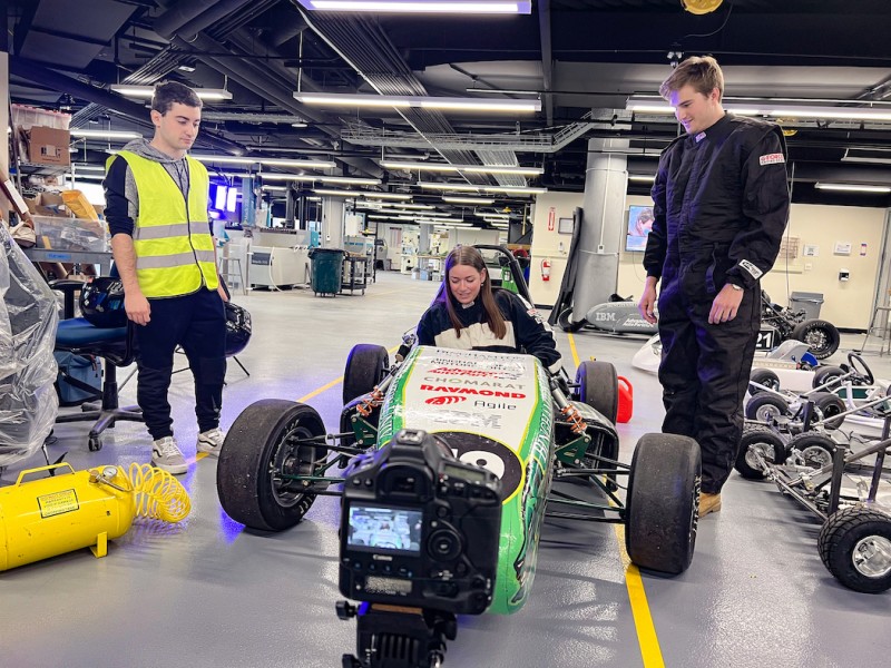 Chloe Van Caeseele films a scene for the tour exploring the many labs on campus.