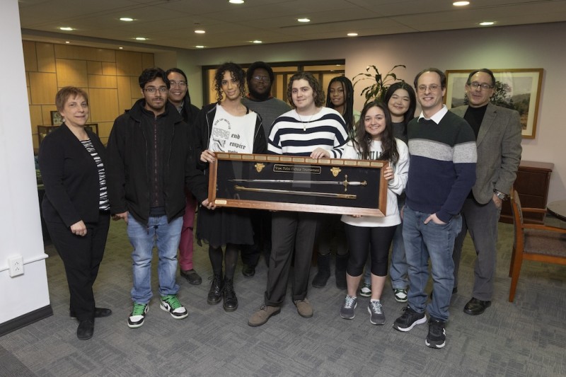 Harpur College of Arts and Sciences Dean Celia Klin was one of the first to congratulate the Binghamton University Debate Team, pictured here from left: Akif Choudhury, Vincent Li, Sonnie Picallo, DM Woodward, Jeremy Santora, Ashley King, Kate Marin, Irene Cui, Joe Schatz, (Director of Speech and Debate) and Steve Ortiz (Director; Executive Director-University Scholars; Assistant Vice Provost for Academic Enrichment and Executive Director; Associate Professor) for winning the West Point Debate Tournament.