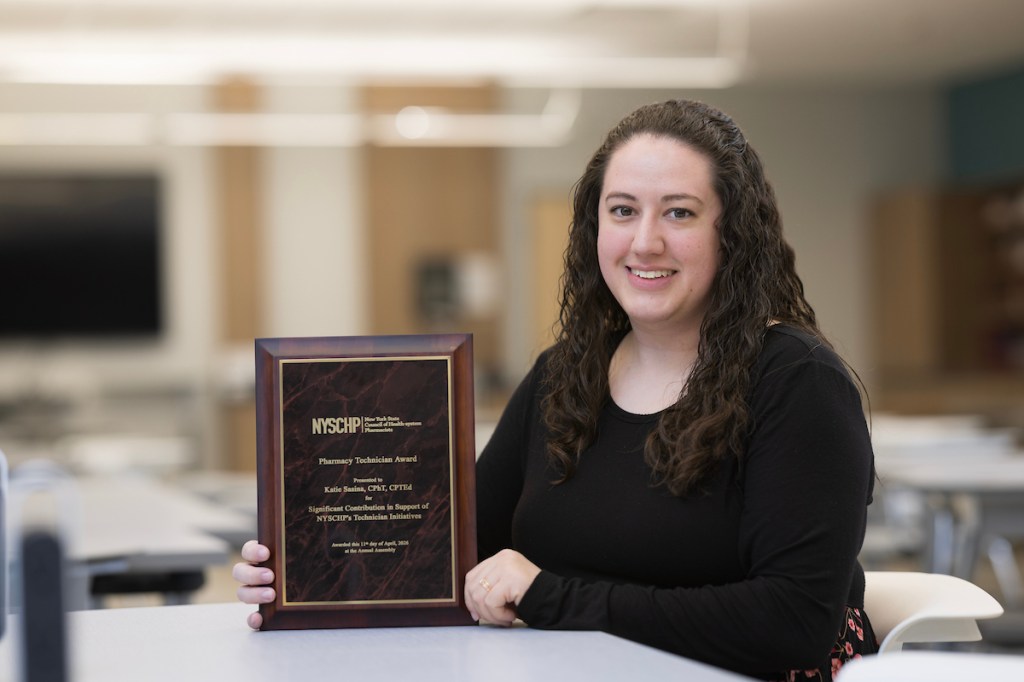 Katie Sasina, Instructional Support Associate at the School of Pharmacy and Pharmaceutical Sciences was awarded the New York State Council of Health-system Pharmacists the Pharmacy Technician Award for Significant Contribution in Support of NYSCP's Technician Initiative. Sasina photographed at the Pharmacy Building in Johnson City, April 13, 2026.